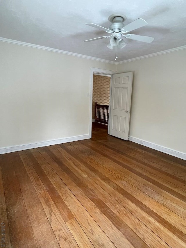 spare room featuring crown molding, ceiling fan, and hardwood / wood-style flooring