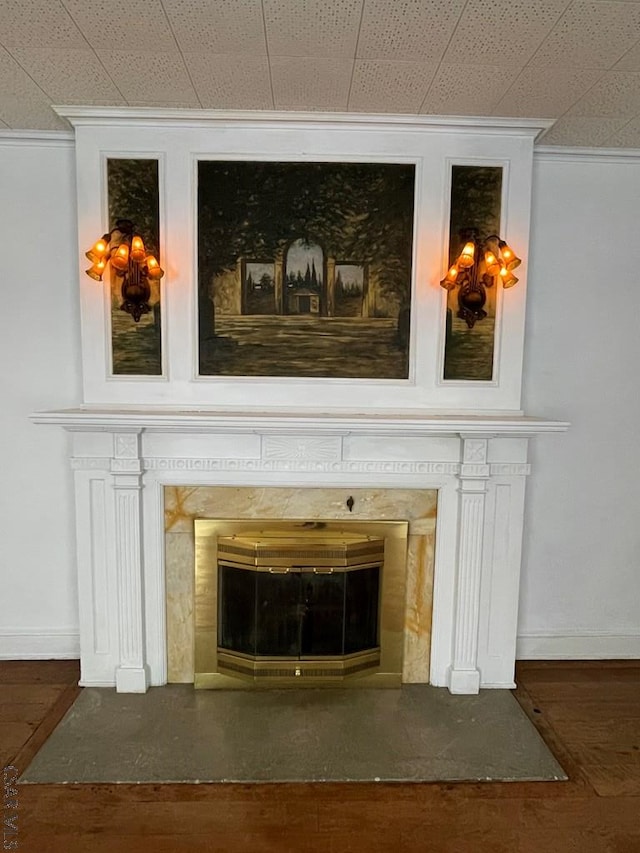 details featuring crown molding and hardwood / wood-style flooring