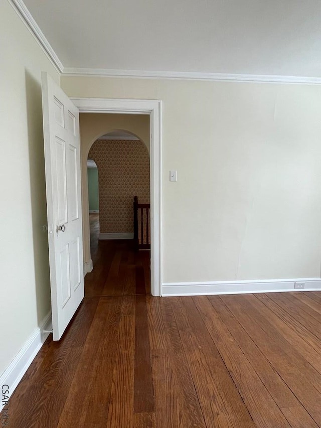 hallway with ornamental molding and dark hardwood / wood-style floors