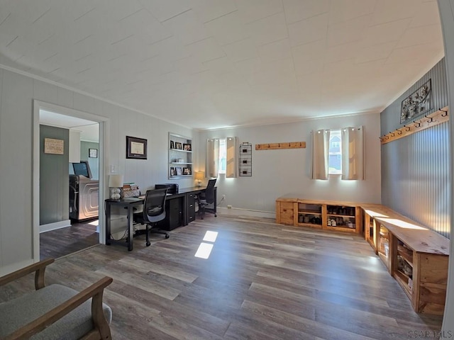 home office with ornamental molding and dark hardwood / wood-style floors