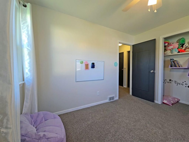 bedroom with ceiling fan and carpet flooring