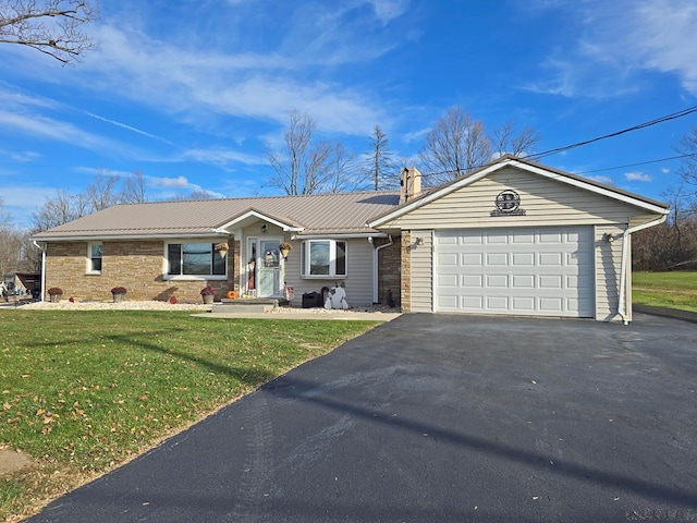 ranch-style home with a garage and a front yard