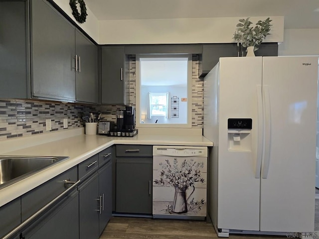 9285 Mason Dixon Hwy, Salisbury, PA 15558 - kitchen featuring gray cabinets, dark wood-type flooring, white appliances, and decorative backsplash