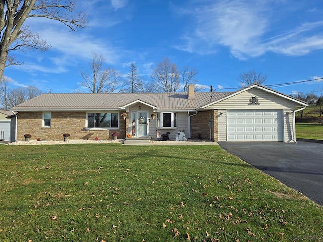 ranch-style home featuring a garage and a front lawn