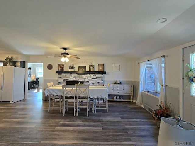 dining space featuring dark hardwood / wood-style floors and ceiling fan