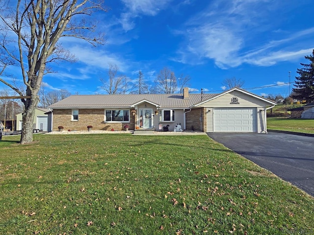 single story home with a garage and a front lawn