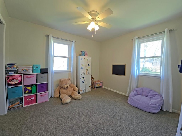 game room with ceiling fan, a healthy amount of sunlight, and carpet floors