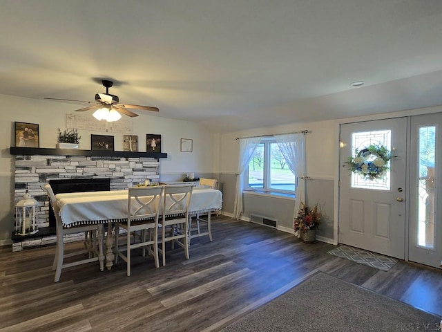 dining area featuring dark wood-type flooring and ceiling fan