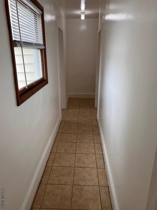 corridor with tile patterned floors