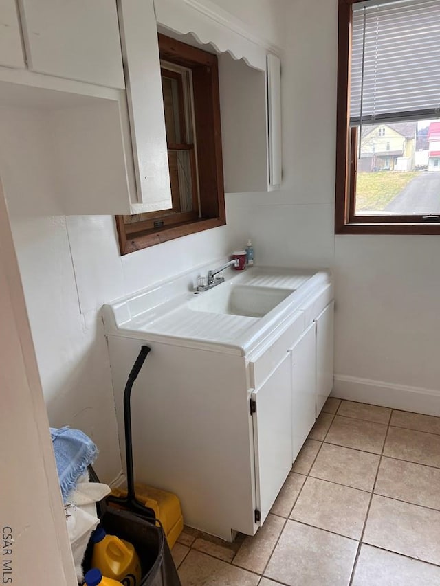 bathroom with tile patterned flooring and sink