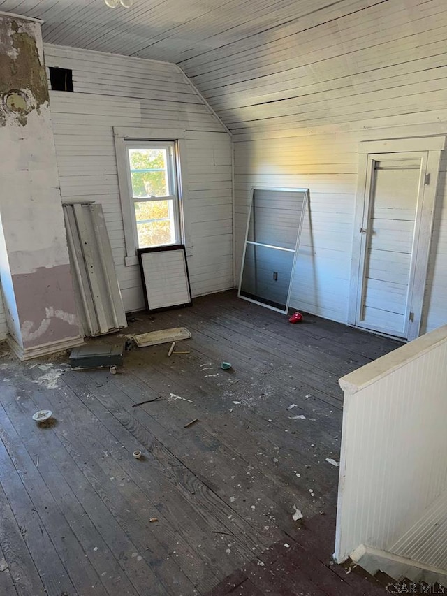 bonus room with wooden ceiling, vaulted ceiling, and dark wood-style flooring