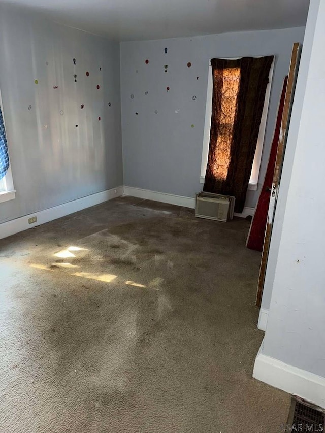 spare room with carpet floors and baseboards