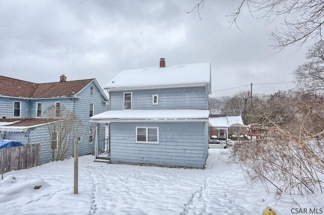 view of snow covered house