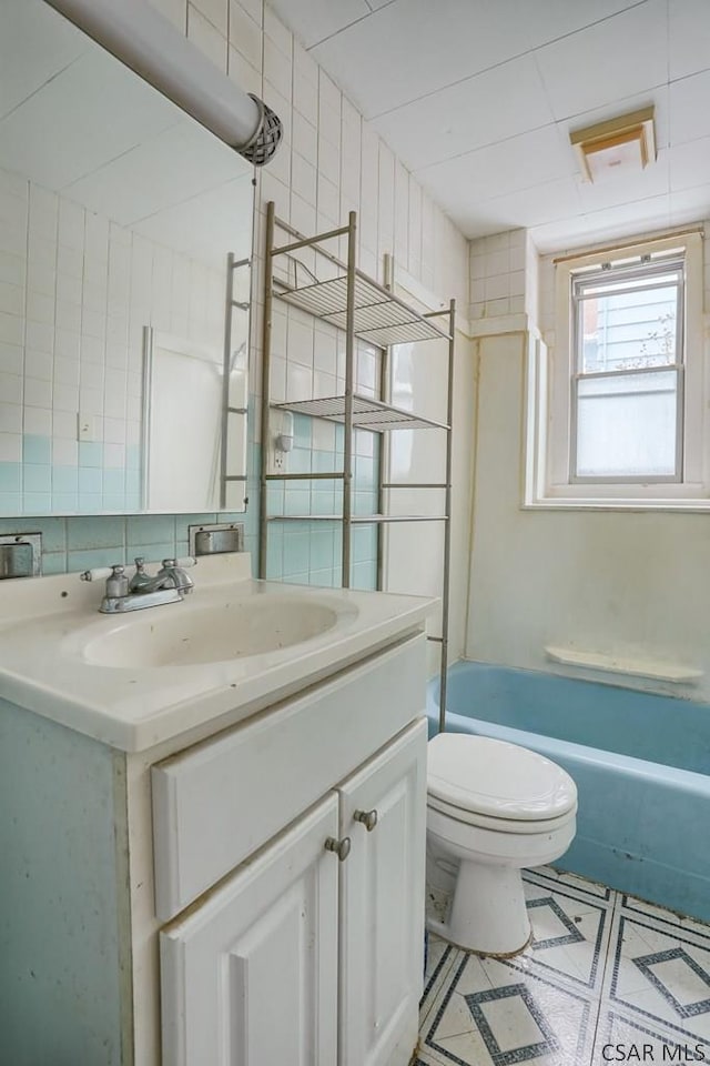 full bathroom featuring vanity, toilet, and shower / bath combination