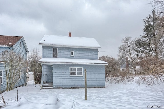 view of snow covered house