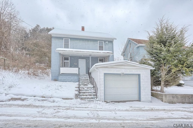 view of front of home featuring a garage and a porch