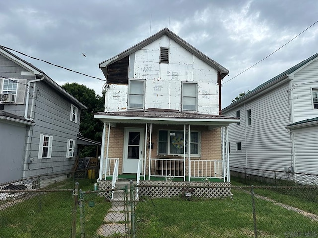 1008 Conemaugh Ave, Portage, PA 15946 - view of front of home featuring covered porch, a gate, brick siding, and a fenced front yard