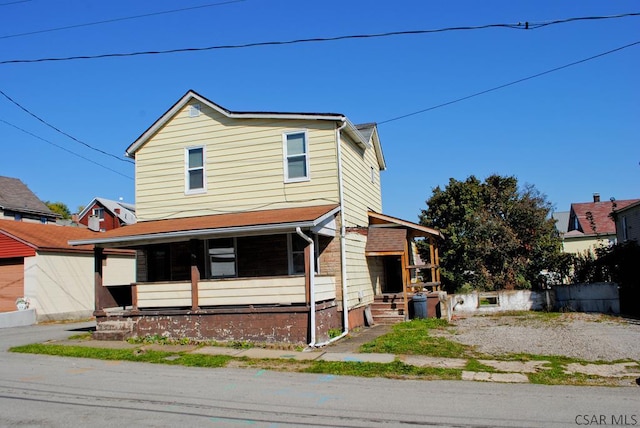 view of front of home featuring covered porch