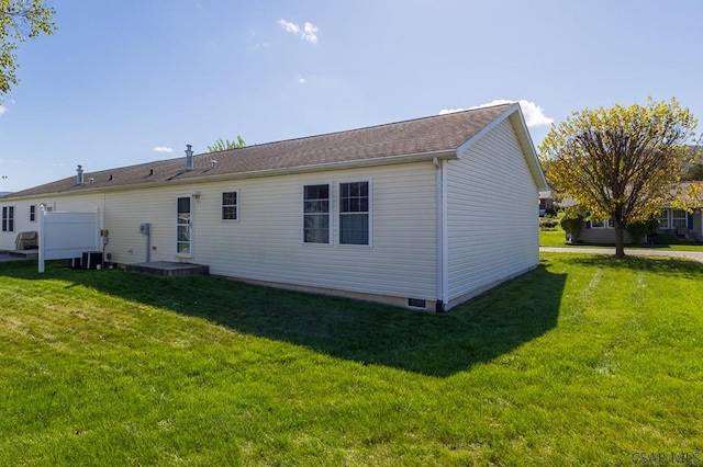 back of property featuring a yard