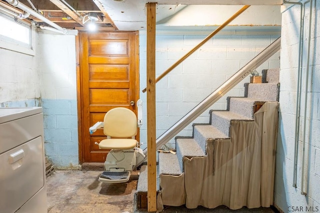 basement featuring washer / clothes dryer and stairs