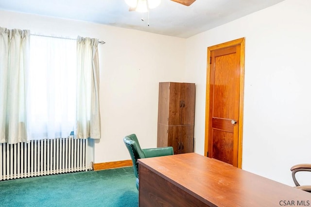 home office featuring baseboards, carpet, radiator heating unit, and a ceiling fan