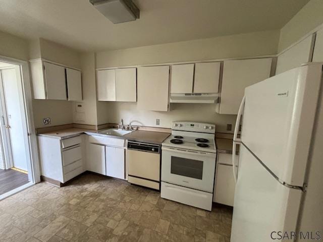 kitchen featuring sink, white cabinets, and white appliances