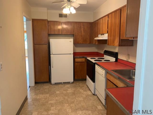 kitchen with ceiling fan, white appliances, and sink