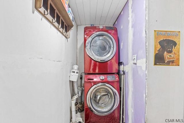 laundry room with stacked washer and dryer