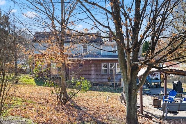 view of side of home featuring a patio