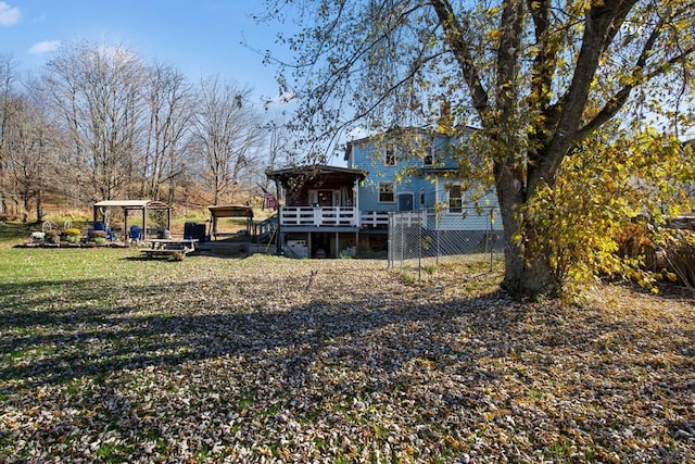 back of property featuring a deck