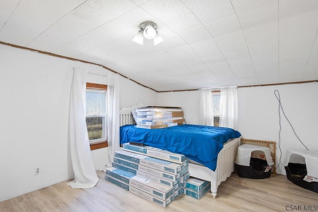 bedroom with light hardwood / wood-style flooring