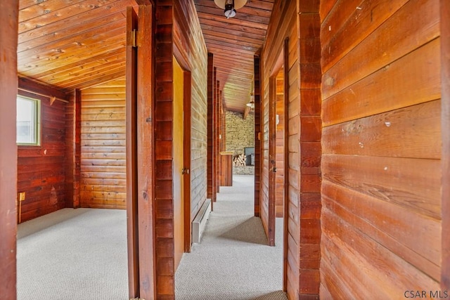 706 Laurel Summit Rd, Boswell, PA 15531 - hall featuring wood ceiling, wooden walls, vaulted ceiling, and carpet floors