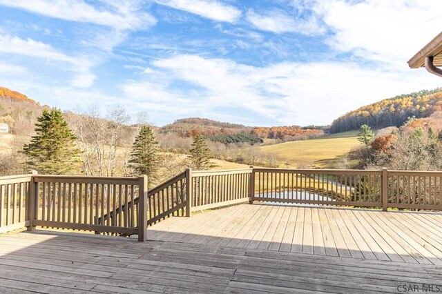 wooden terrace featuring a mountain view