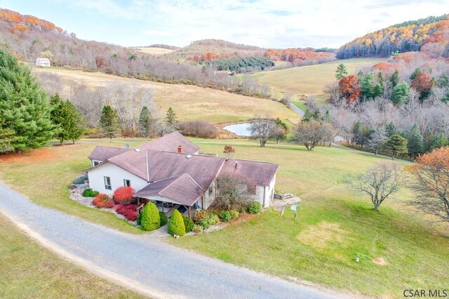 drone / aerial view with a mountain view and a rural view