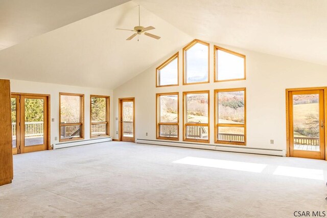 unfurnished living room with ceiling fan, a baseboard heating unit, light carpet, and high vaulted ceiling