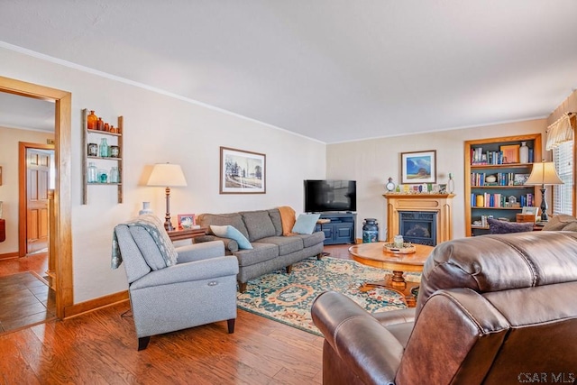352 W Garrett St, Somerset, PA 15501 - living room with baseboards, ornamental molding, a glass covered fireplace, and wood finished floors