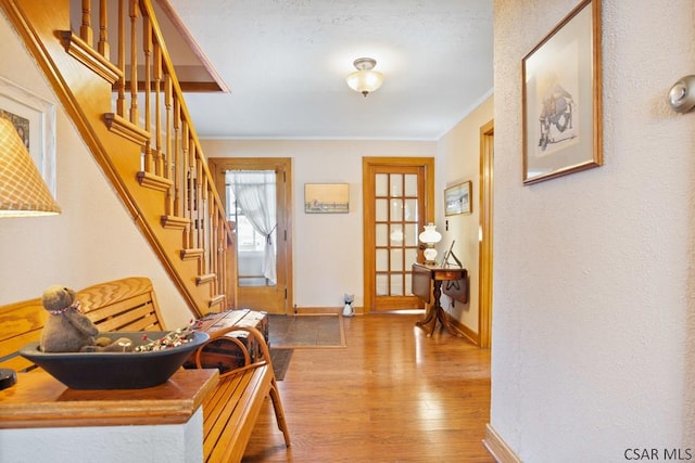 352 W Garrett St, Somerset, PA 15501 - entryway featuring baseboards, stairway, hardwood / wood-style flooring, and ornamental molding