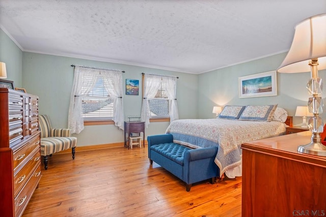 352 W Garrett St, Somerset, PA 15501 - bedroom featuring light wood-style flooring, baseboards, a textured ceiling, and crown molding