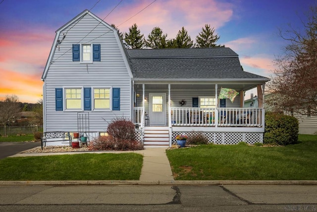 352 W Garrett St, Somerset, PA 15501 - colonial inspired home with a porch, a gambrel roof, roof with shingles, and a lawn