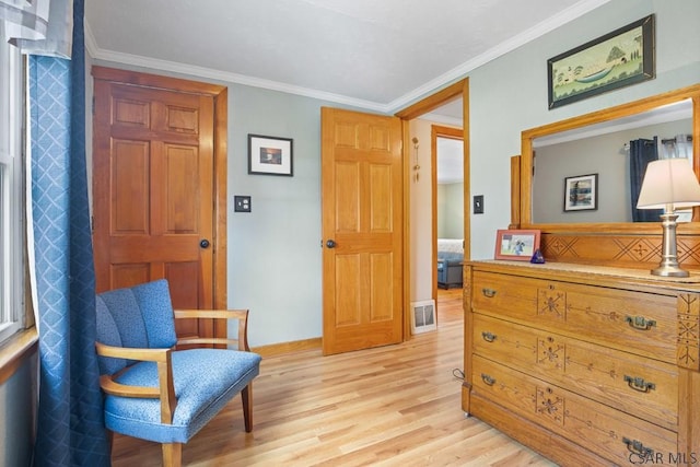 352 W Garrett St, Somerset, PA 15501 - living area with light wood-type flooring, visible vents, crown molding, and baseboards