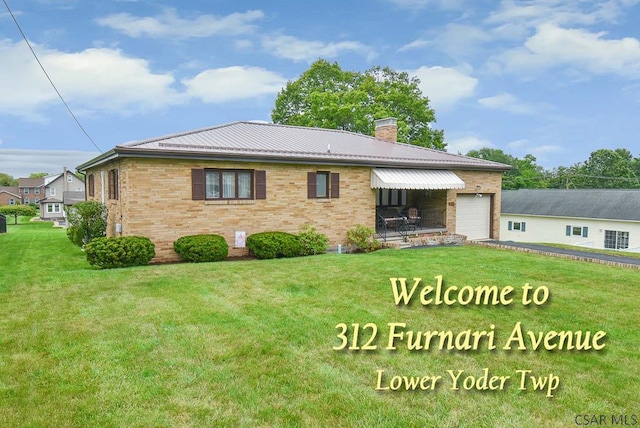 312 Furnari Ave, Johnstown, PA 15905 - rear view of property featuring brick siding, a chimney, a yard, and an attached garage