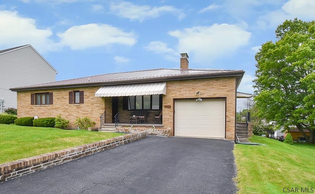 312 Furnari Ave, Johnstown, PA 15905 - ranch-style home featuring a garage, a chimney, a front lawn, and brick siding