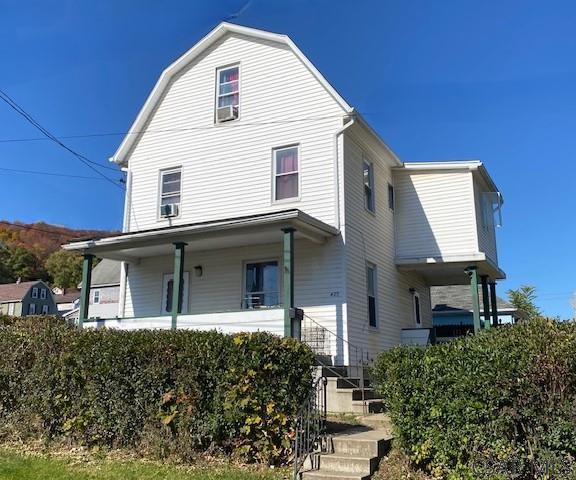 front of property featuring covered porch