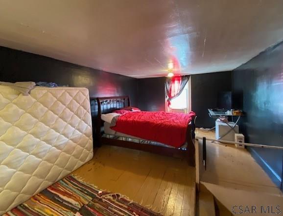 bedroom featuring wood-type flooring