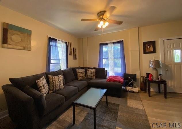 living room featuring hardwood / wood-style flooring and ceiling fan