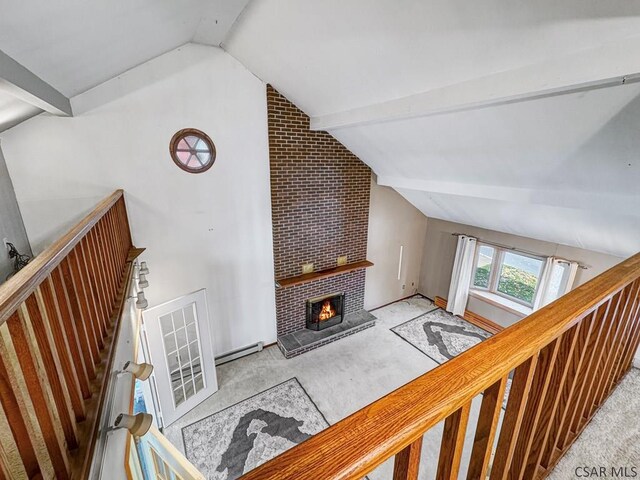 bonus room featuring baseboard heating, a fireplace, lofted ceiling with beams, and light carpet