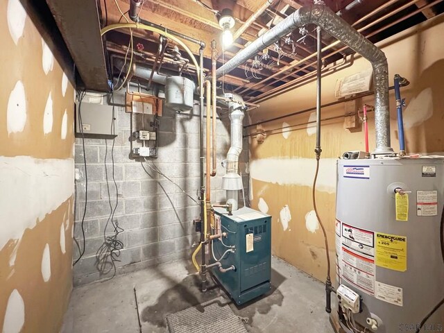 utility room featuring water heater