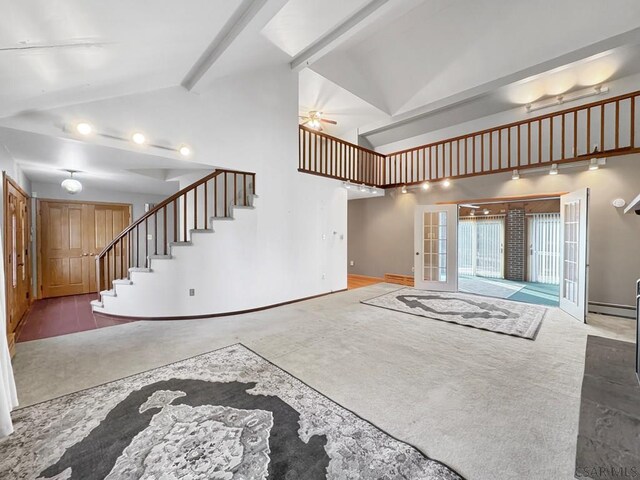 living room with ceiling fan, a baseboard radiator, vaulted ceiling, and french doors