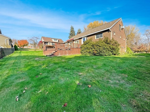 view of yard featuring a wooden deck