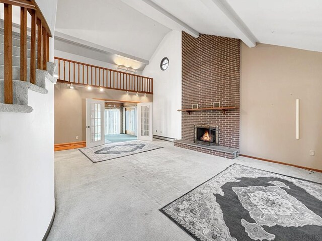 unfurnished living room with a baseboard heating unit, a fireplace, lofted ceiling with beams, and carpet flooring